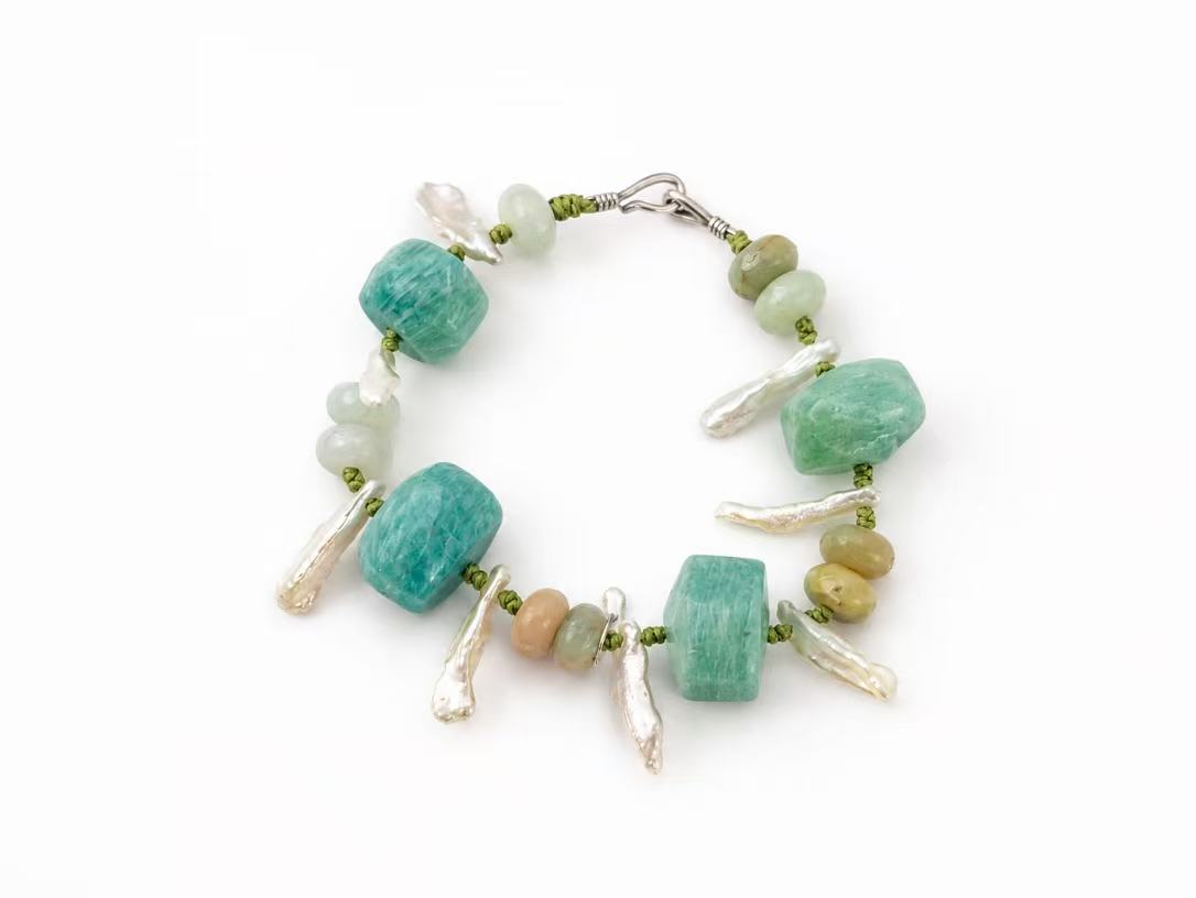 Green Pulse bracelet photographed on a white background